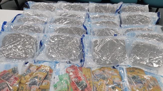 Cash and cannabis seized during the Australian Federal Police operation.