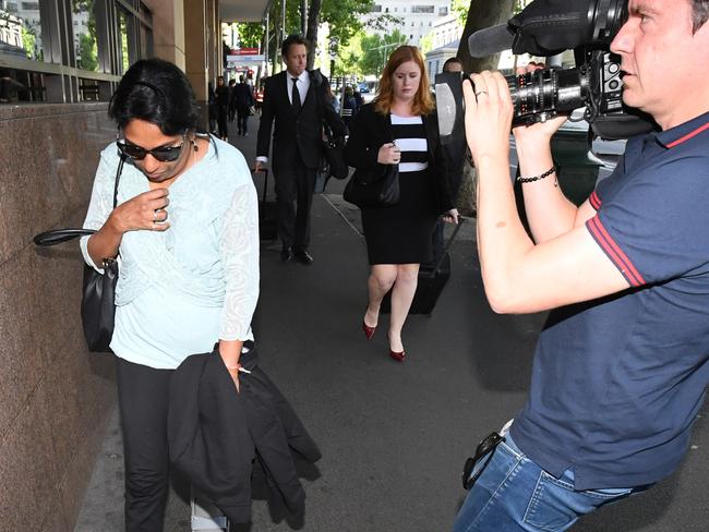 Kumuthini Kannan (left) is seen exiting the Melbourne Magistrates' Court in Melbourne, Monday December 11, 2017. Kumuthini and Kandasamy Kannan are accused of keeping a woman as a slave at their Mount Waverley home for more than eight years. (AAP Image/James Ross) NO ARCHIVING