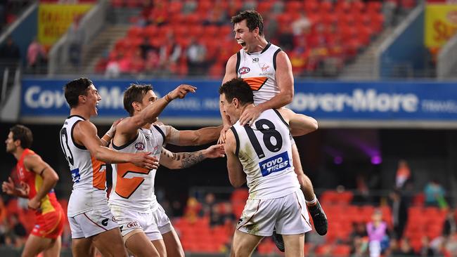 Giants teamates celebrate with Jeremy Cameron during his goal fest Picture: AAP Image/Dave Hunt