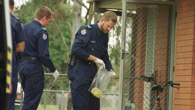 Police collect evidence at the murder scene of Margaret Rose James in Caboolture. Picture: Graeme Parkes