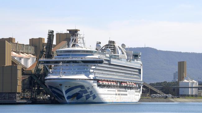 Buses line up on dock to ferry almost 50 crew to Sydney from the disease-stricken Ruby Princess. Picture: Simon Bullard