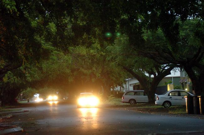 Woongarra Street lit by car headlights. 