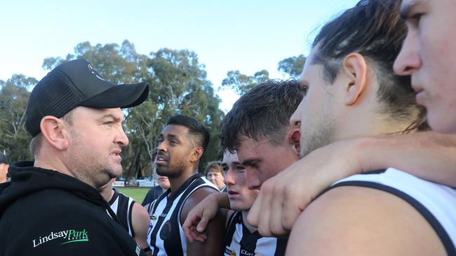 Euroa coach Scott Rowan speaks to his players during a break in the clash against Echuca.