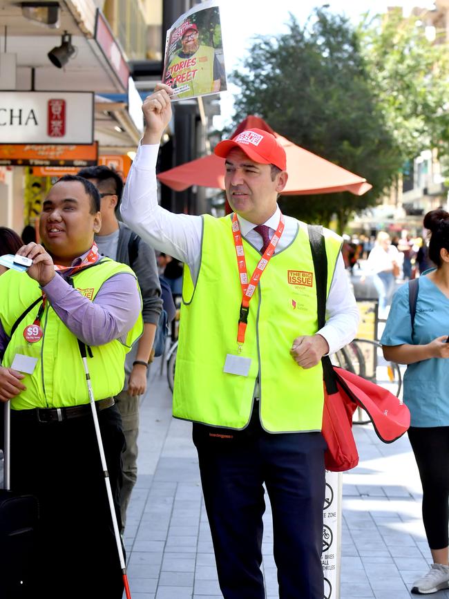 SALESMAN: SA Premier Steven Marshall sells the Big Issue magazine at the corner of Rundle Mall and King William Street this week: Picture: Sam Wundke/AAP