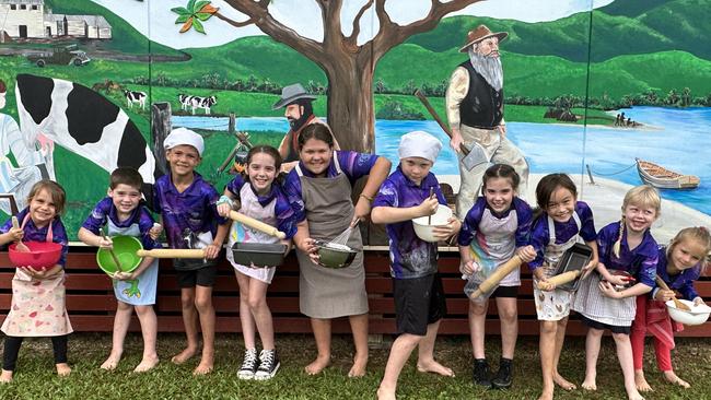 Daintree State School students Tia Welham, Chase Mulley, Harlex Weier, Thea Mulley, Bailee Weier, Braxton Wilkins, Lara Mulley, Emily Torenbeek, Rayna Wilkins and Ayana Toth at the newly-painted centenary mural. Picture: Supplied