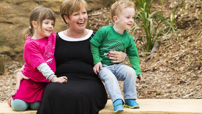 Sienna Hughes, four, Joan Murray and Callum Gibbons, 3, at Rainbow Pre-school, in Winmalee, today. Pride of Australia nominee Joan Murray who has run the Rainbow Pre-school, in Winmalee, for 19 years and last October was trapped in the preschool with 12 of the children with the fire just 3 metres from the back door.