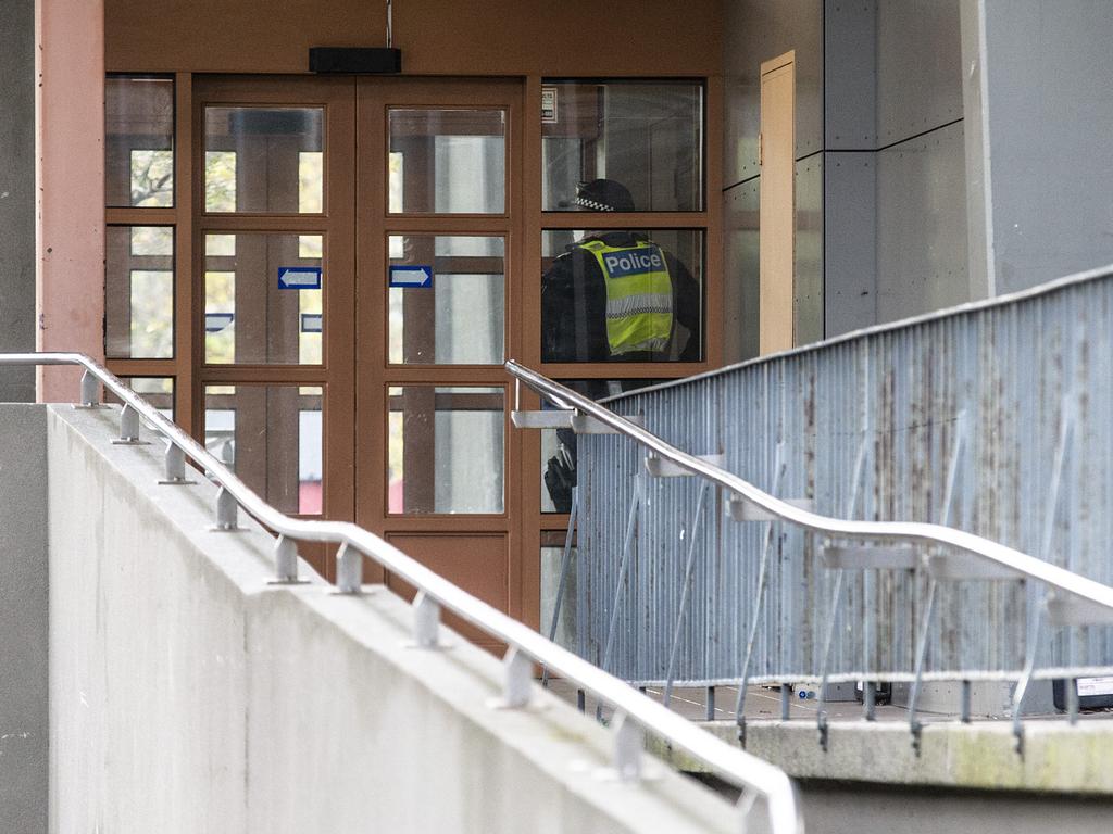 Police block off all entry points to a public housing tower in Melbourne. Picture: Sarah Matray