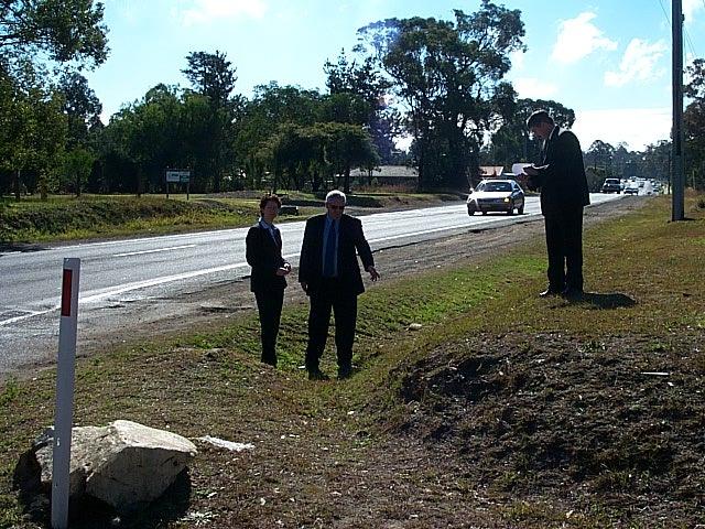 Mick Ashwood, Canadian Mountie and geographic profiler Scot Filer and NSW criminal profiler Kris Illingsworth at a drain culvert on Remembrance drive near Tahmoor. Picture Supplied