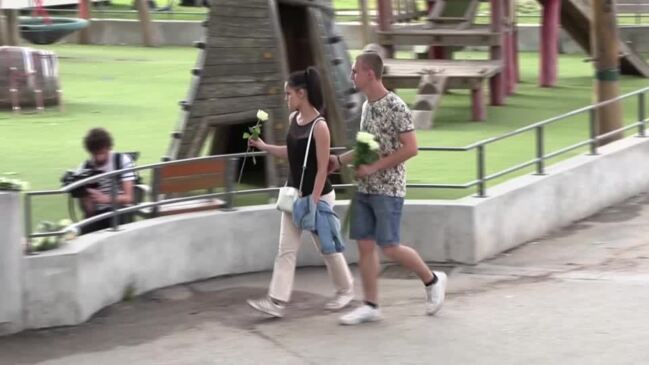 Shocked residents lay white roses at Annecy playground