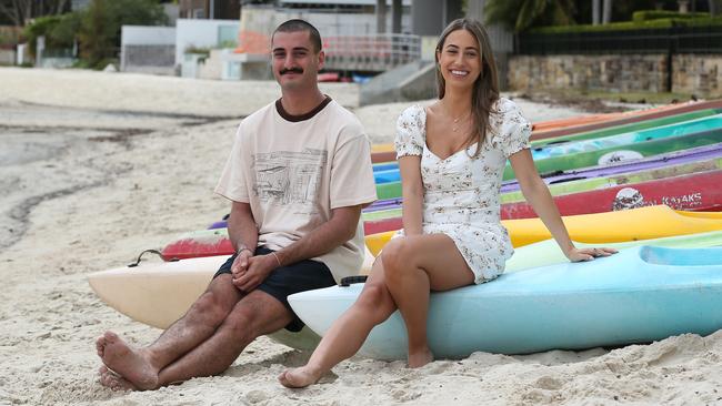 Sun-smart friends George Dovellos, 22, and Maddie Missikos, 27 – at Sydney’s Rose Bay beach – say they are aware of the risks of skin cancer and will get checked. Picture: Britta Campion / The Australian