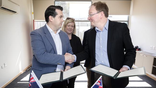 Federal Housing Minister Michael Sukkar, Bridget Archer MP and Tasmanian Minister for Housing Roger Jaensch sign the breakthrough agreement at Newnham. Picture: CHRIS KIDD