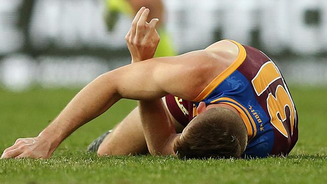 Harris Andrews lays on the ground after he was knocked out. Picture: Getty Images