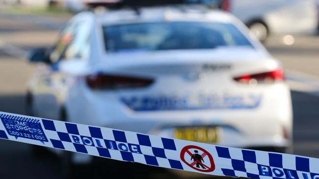 SYDNEY, AUSTRALIA - NEWSWIRE PHOTOS June 14 2022: A general stock image of a Police tape in front of a Police car in Sydney. Picture NCA Newswire/ Gaye Gerard.