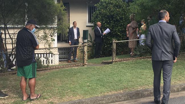 Auctioneer Phil Parker takes a bid at the auction at 32 Ilford St, Gordon Park. Picture: Darren Cartwright