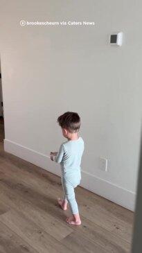 Little boy brings his baby sister breakfast