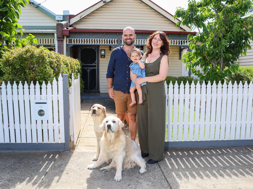 Elliot Giakalis, Chantelle Sass, their daughter Odette and dogs Theo and Sammy at their Coburg house. Picture: Brendan Beckett