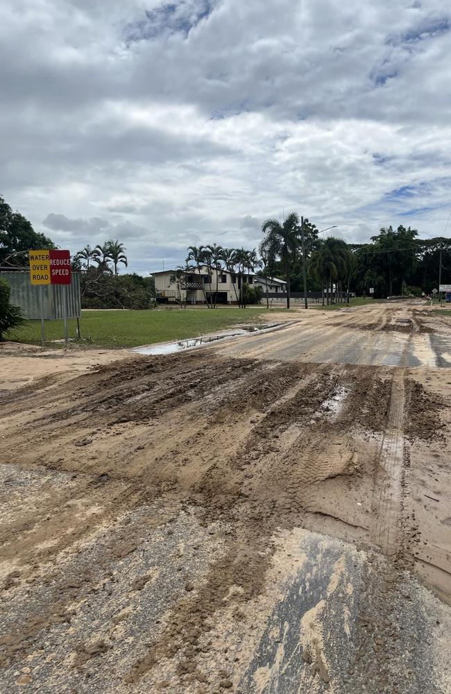 Think mud coating Eddleston Dr that runs through the flood-ravaged town. Picture: Cameron Bates