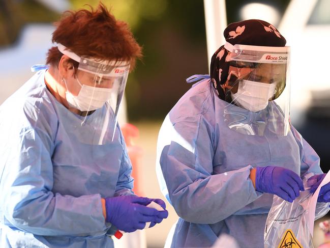 BRISBANE, AUSTRALIA - NewsWire Photos - AUGUST 6, 2021. Health workers perform duties at a pop up Covid-19 testing clinic at Eight Miles Plains in Brisbane's south, as Queensland remains in lockdown due to a growing covid cluster.Picture: NCA NewsWire / Dan Peled