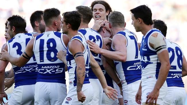 The Roos mobbed Scott after he kicked a goal on debut. Picture: Getty Images