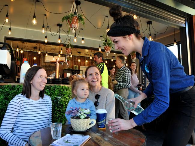 Alisha Muldoon (left) and Maddy Carrigan with two-year-old Natalia Heiner talk to waitress Abby Burden at Doppio Cafe in Bathurst. Picture: Zenio Lapka