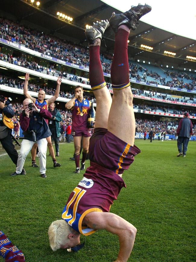 Jason Akermanis does his handstand after the 2003 Grand Final.