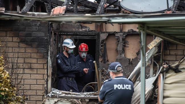 Police and Fire Investigators at the scene of a house fire in Rowe Terrace, Darra where the body of woman was found. PICTURE: Brad Fleet