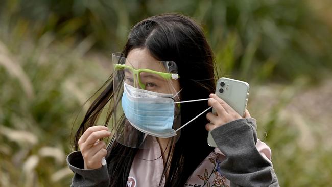SYDNEY, AUSTRALIA - NewsWire Photos, SEPTEMBER, 25, 2021: Members of the public wear face masks as they check in at the NSW Health Sydney Olympic Park Vaccination Centre, in Sydney. Picture: NCA NewsWire/Bianca De Marchi