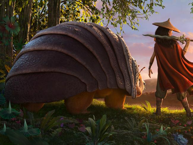 As an evil force threatens the kingdom of Kumandra, it is up to warrior Raya, and her trusty steed Tuk Tuk, to leave their Heart Lands home and track down the last dragon to help stop the villainous Druun. Picture: Disney