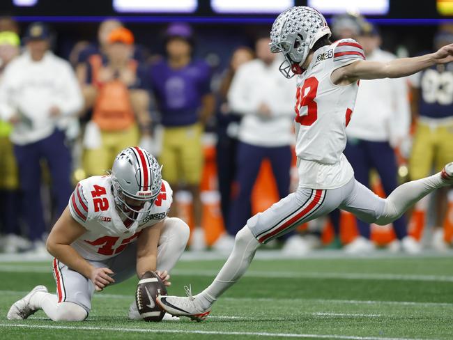 McGuire (42) and Jayden Fielding (38) in action for the Ohio State Buckeyes. Picture: Todd Kirkland