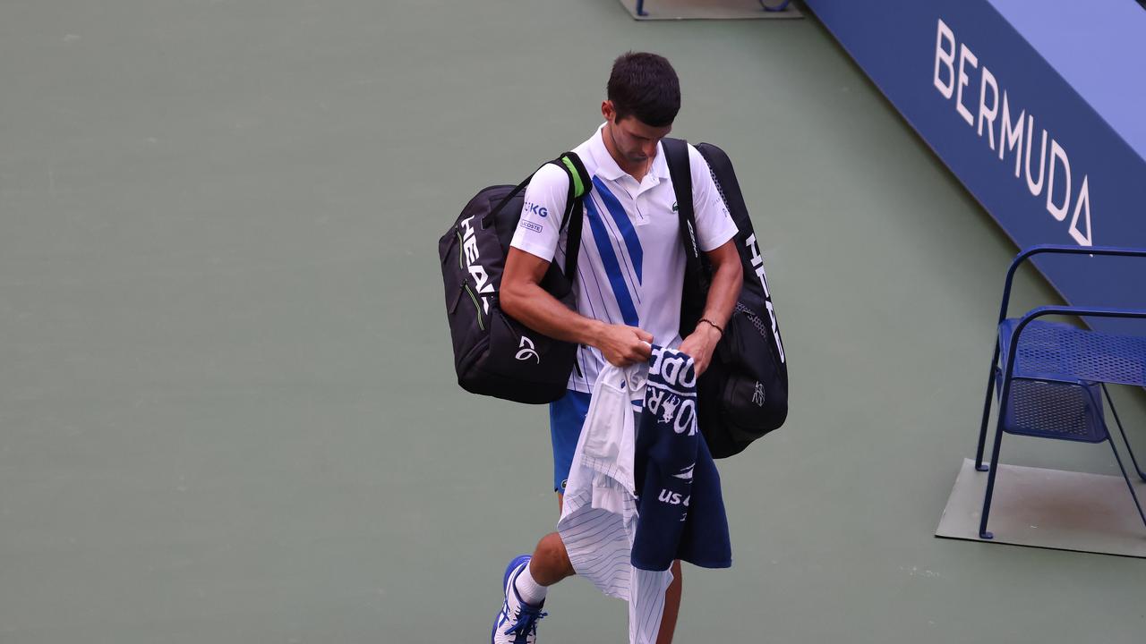 Novak Djokovic leaves the US Open after being defaulted for hitting a lineswoman with a ball in an angry outburst.