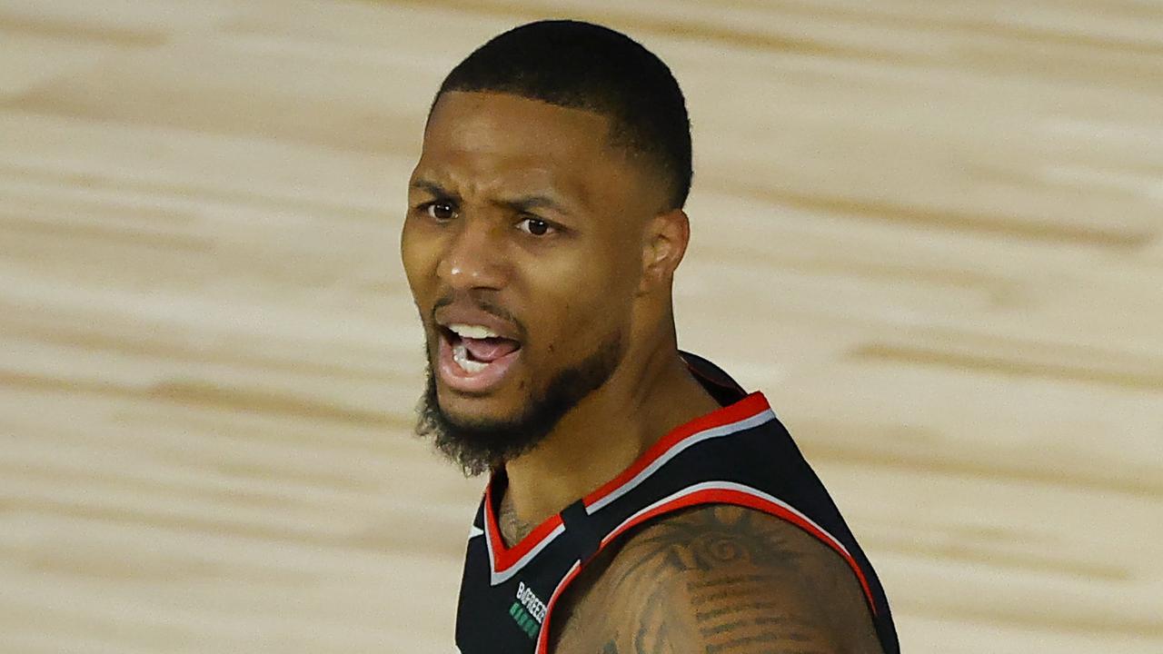 LAKE BUENA VISTA, FLORIDA - AUGUST 15: Damian Lillard #0 of the Portland Trail Blazers reacts against the Memphis Grizzlies during the second quarter in the Western Conference play-in game one at The Field House at ESPN Wide World Of Sports Complex on August 15, 2020 in Lake Buena Vista, Florida. (Photo by Kevin C. Cox/Getty Images)