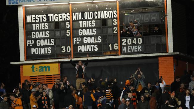 Wests Tigers supporters celebrate their win over the Cowboys at Leichhardt oval. Picture: Phil Hillyard