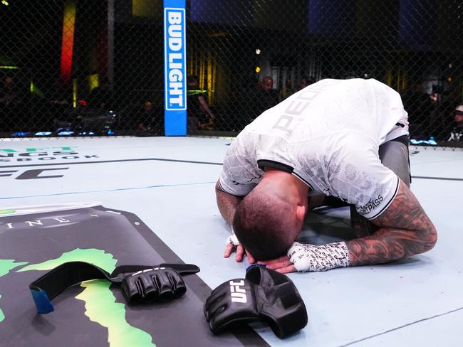 LAS VEGAS, NEVADA - MARCH 02: Tyson Pedro of Australia announces his retirement after a loss against Vitor Petrino of Brazil in a light heavyweight bout during the UFC Fight Night event at UFC APEX on March 02, 2024 in Las Vegas, Nevada. (Photo by Jeff Bottari/Zuffa LLC via Getty Images)