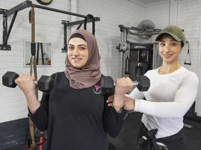 Taha (right), pictured with Hana Ella, is a role model to many of her clients. Picture: Ellen Smith