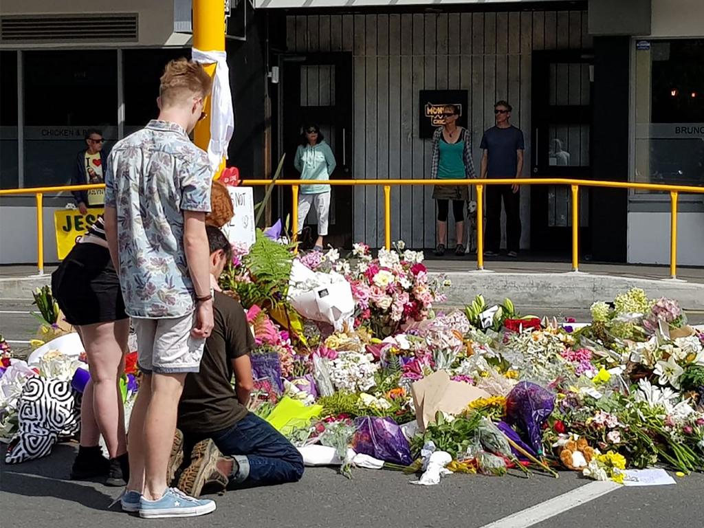 Residents pay their respects by placing flowers for the victims of the mosques attacks in Christchurch. Picture: AFP