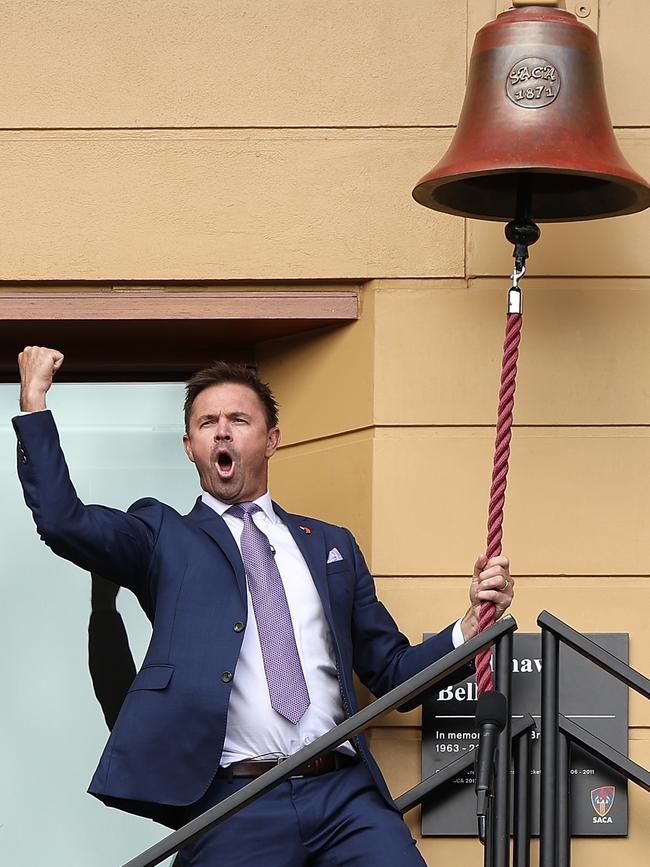 Former South Australian cricket star Greg Blewett celebrates ringing the Bradshaw Bell during last season’s Australia versus West Indies Test at Adelaide Oval. Picture: Paul Kane/Getty Images