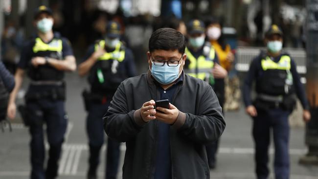 Face coverings were made mandatory in Melbourne and $200 fines applied for not wearing one. Picture: Getty Images