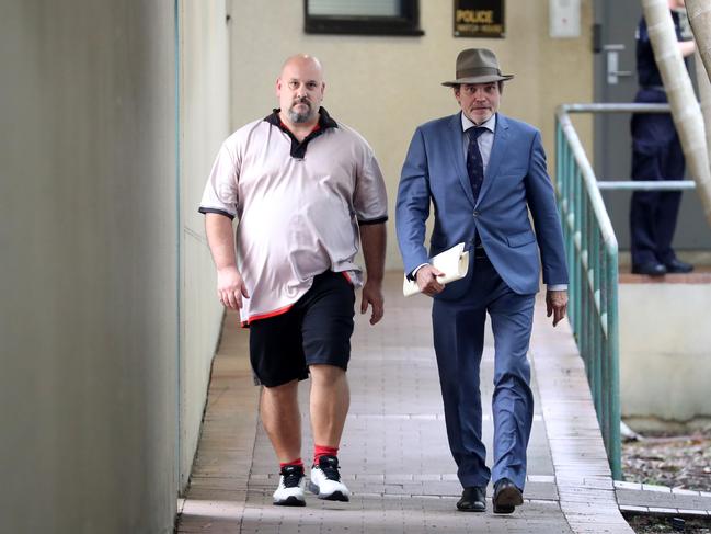 Michael Glenn Lewis leaving the Cairns watch house with his solicitor Derek Perkins. Picture: Stewart McLean