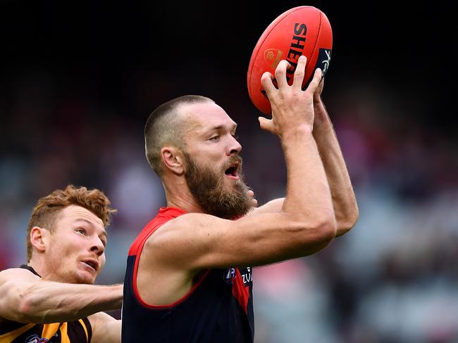 MELBOURNE, AUSTRALIA - MAY 04: Max Gawn of the Demons marks infront of Tim O'Brien of the Hawks during the round seven AFL match between the Melbourne Demons and the Hawthorn Hawks at Melbourne Cricket Ground on May 04, 2019 in Melbourne, Australia. (Photo by Quinn Rooney/Getty Images)