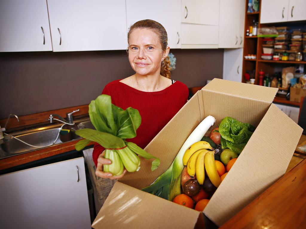 Rebecca Swan with her regular box of ‘fugly’ fruit and veg. Picture: Sam Ruttyn