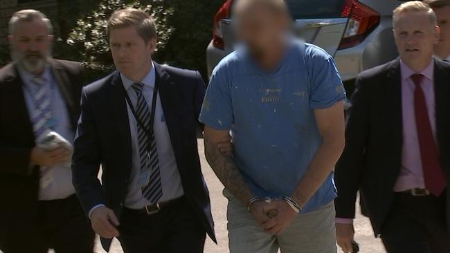 A Bowenfels man being taken into police custody following the death of Lithgow woman Jenoa Sutton. Picture: NSW Police Force