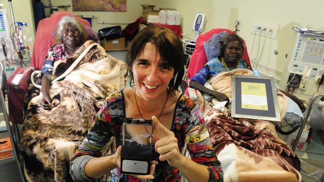 CEO of Western Desert Dialysis Sarah Brown with the recent 2013 National Disability Recipient, Excellence in Accessible Communities Award at The Purple House in Alice Springs. Sarah is photographed here with Yuendumu residents Mavis Wayne and Jeannie Collins as they receive dialysis at the Purple House. PICTURE: Emma Murray