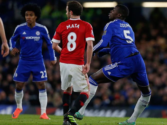 Chelsea's French defender Kurt Zouma (R) lands awkwardly before a serious injury.