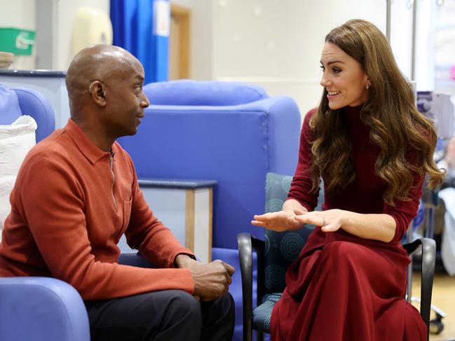 Kate talks with Peter Burton on the trip to her former hospital. Picture: Getty Images