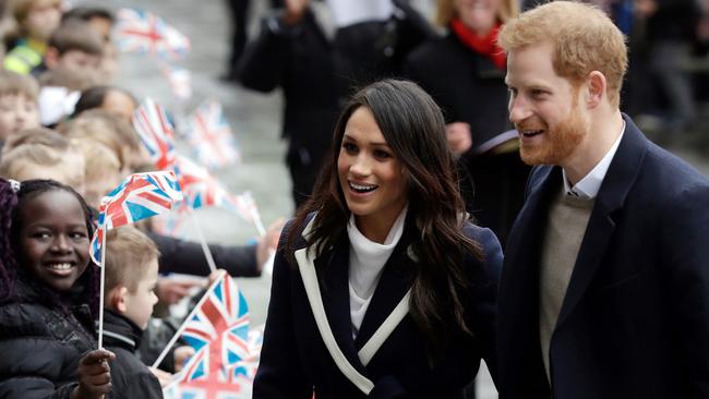 The couple greeting crowds in Birmingham. (AP Photo/Matt Dunham, File)