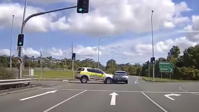 Dramatic footage shows ambulance colliding with a car, causing it to flip