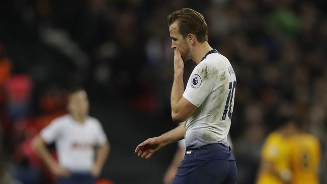 Harry Kane walks from the pitch after his side were stunned by Wolves.