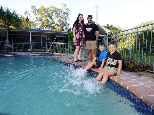 Lauren and Tyson Halliwell, with their kids Ethan Halliwell 6yrs, Jamie Halliwell 5yrs, have just moved into their new Park Ridge home while becoming investors, deciding keep their first home in Logan, Park Ridge South, on Tuesday 16th April 2024 - Photo Steve Pohlner