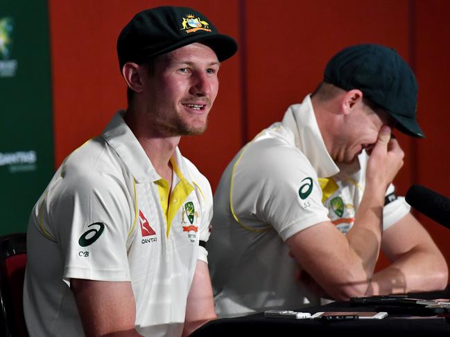 Cameron Bancroft (left) and Steve Smith (right) of Australia are seen reacting as they answer questions from the media about England wicketkeeper Jonny Bairstow at a post match press conference on Day 5 of the First Ashes Test match between Australia and England at the Gabba in Brisbane, Monday, November 27, 2017. (AAP Image/Darren England) NO ARCHIVING, EDITORIAL USE ONLY, IMAGES TO BE USED FOR NEWS REPORTING PURPOSES ONLY, NO COMMERCIAL USE WHATSOEVER, NO USE IN BOOKS WITHOUT PRIOR WRITTEN CONSENT FROM AAP