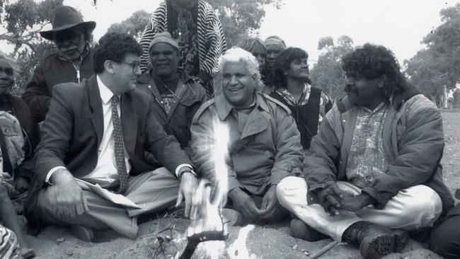 Former premier Lynn Arnold with the late Maralinga test survivor Yami Lester at Umuwa Creek in 1993. Mr Lester lost his eye sight after the Maralinga nuclear tests.